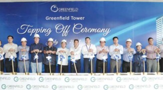 Greenfield District tops off two towers